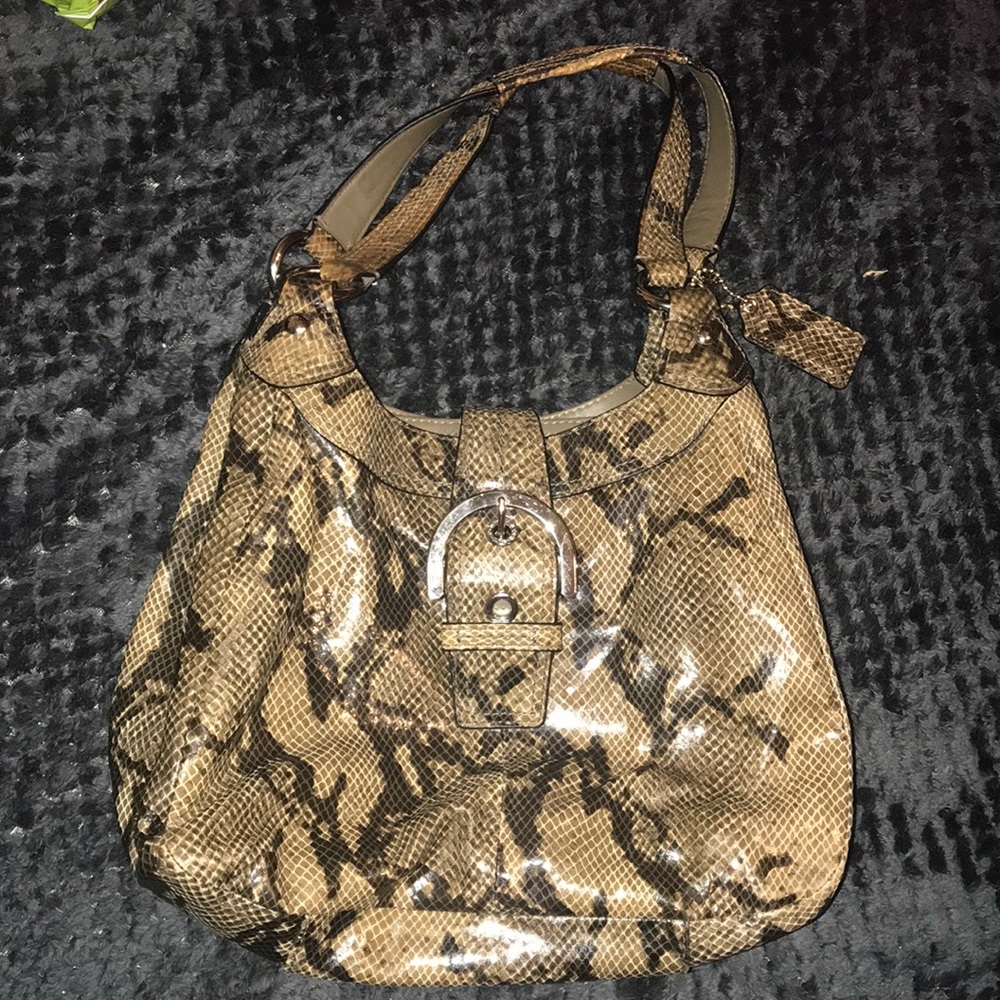 Slightly used coach purse snakeskin print